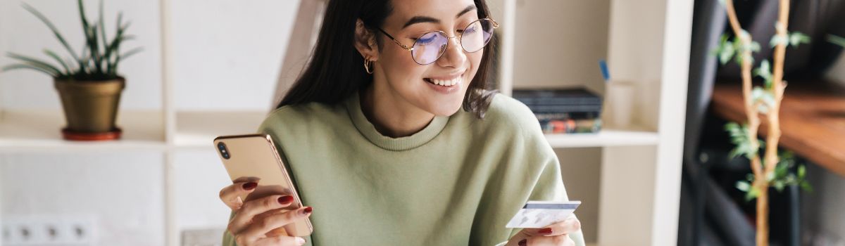 Young girl using credit card